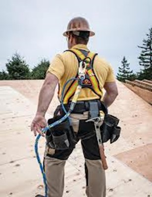 worker wearing fall protection system